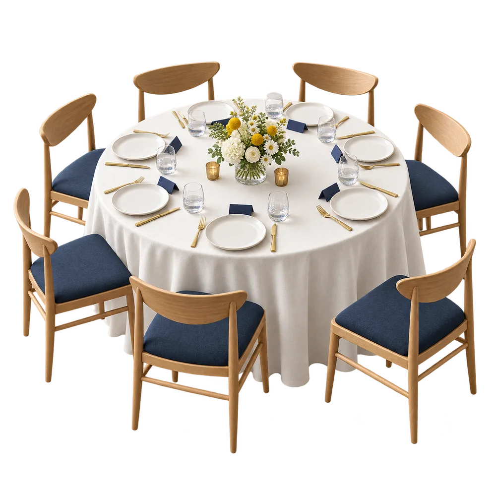 A miniature banquet table set for eight guests with linen, place cards and flowers.